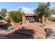 Brick home with inviting patio and landscaping at 56444 N Vulture Mine Rd, Wickenburg, AZ 85390