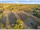 Large riding arena with horses and equipment at 56444 N Vulture Mine Rd, Wickenburg, AZ 85390