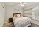 Bedroom with gray and orange color scheme and a ceiling fan at 1509 E Peach Tree Dr, Chandler, AZ 85249