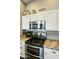 Kitchen features stainless steel appliances and granite countertops at 1509 E Peach Tree Dr, Chandler, AZ 85249