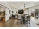 Open living room with a farmhouse feel, featuring wood floors and a TV at 1509 E Peach Tree Dr, Chandler, AZ 85249