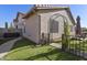 Landscaped backyard with artificial turf and wrought iron gate at 1509 E Peach Tree Dr, Chandler, AZ 85249