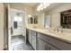 Double vanity bathroom with a large mirror and walk-in shower at 1509 E Peach Tree Dr, Chandler, AZ 85249