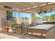 Outdoor grilling area with multiple grills and seating at 1509 E Peach Tree Dr, Chandler, AZ 85249