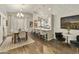 Bright dining room features a table with six chairs and hardwood floors at 1509 E Peach Tree Dr, Chandler, AZ 85249