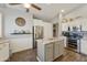 Spacious kitchen with island, stainless steel appliances and wood floors at 1509 E Peach Tree Dr, Chandler, AZ 85249