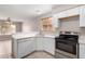 Updated kitchen featuring white cabinets and stainless steel appliances at 2737 S 156Th Ave, Goodyear, AZ 85338