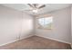 Well-lit bedroom with window and ceiling fan at 2737 S 156Th Ave, Goodyear, AZ 85338