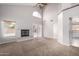 Bright and airy living room with a fireplace and access to backyard at 2737 S 156Th Ave, Goodyear, AZ 85338