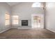 Bright living room features a fireplace, sliding glass doors to backyard, and vaulted ceiling at 2737 S 156Th Ave, Goodyear, AZ 85338