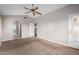 Well-lit bedroom with access to bathroom and another room at 2737 S 156Th Ave, Goodyear, AZ 85338