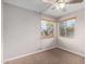Charming bedroom with two windows and a ceiling fan at 2737 S 156Th Ave, Goodyear, AZ 85338
