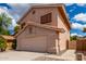 Two-story stucco home with a two-car garage and a walkway at 2737 S 156Th Ave, Goodyear, AZ 85338