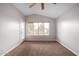 Bright bedroom featuring a window and ceiling fan at 2737 S 156Th Ave, Goodyear, AZ 85338