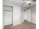 Bright bedroom with sliding door closet and access to a hallway at 2737 S 156Th Ave, Goodyear, AZ 85338