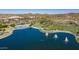 Aerial view of lake, community amenities, and landscape at 18211 W Sequoia Dr, Goodyear, AZ 85338