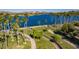Aerial view of lakefront community with walking paths and lush landscaping at 18211 W Sequoia Dr, Goodyear, AZ 85338