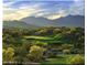 Scenic golf course view with mountains in the background at 18211 W Sequoia Dr, Goodyear, AZ 85338
