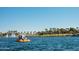 Couple enjoying a paddle boat ride on the lake at 18211 W Sequoia Dr, Goodyear, AZ 85338