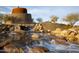 Relaxing water feature with cascading waterfalls and stone accents at 18211 W Sequoia Dr, Goodyear, AZ 85338