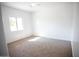 Bright bedroom featuring carpet and neutral walls at 20526 W Teepee Rd, Buckeye, AZ 85326