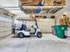 Garage with golf cart, overhead storage, and shelving at 15802 W Avalon Dr, Goodyear, AZ 85395