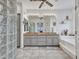 Elegant bathroom with granite countertops and a large soaking tub at 15802 W Avalon Dr, Goodyear, AZ 85395