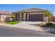 One-story house with a two-car garage and front yard at 42213 W Santa Fe St, Maricopa, AZ 85138