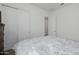 Bedroom with double doors and adjacent bathroom at 18211 W Sequoia Dr, Goodyear, AZ 85338