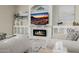 Living room featuring a fireplace and built-in shelving at 18211 W Sequoia Dr, Goodyear, AZ 85338