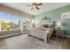 Relaxing main bedroom with large windows and backyard views at 18211 W Sequoia Dr, Goodyear, AZ 85338
