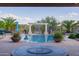 View of the pool and patio area with fire pit at 18211 W Sequoia Dr, Goodyear, AZ 85338