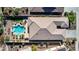 Aerial view of house, pool, and landscaped backyard; surrounded by other homes and golf course at 18211 W Sequoia Dr, Goodyear, AZ 85338