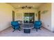 Relaxing patio with fire pit and comfortable seating at 18211 W Sequoia Dr, Goodyear, AZ 85338