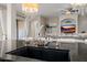 Modern kitchen sink and faucet with granite countertop at 18211 W Sequoia Dr, Goodyear, AZ 85338