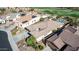 Aerial view of house, pool, and backyard; close to golf course at 18211 W Sequoia Dr, Goodyear, AZ 85338