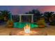Beautiful fire pit with a view of the pool at 18211 W Sequoia Dr, Goodyear, AZ 85338