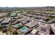 Aerial view of a luxury community with houses, pools, and a golf course at 18211 W Sequoia Dr, Goodyear, AZ 85338