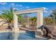 Waterfall feature of the pool with stonework at 18211 W Sequoia Dr, Goodyear, AZ 85338