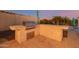 Outdoor kitchen with grill and bar, ideal for entertaining at 18211 W Sequoia Dr, Goodyear, AZ 85338