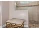 Bathroom with a walk-in shower and tiled walls at 18211 W Sequoia Dr, Goodyear, AZ 85338