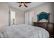 Main bedroom with large dresser and access to other rooms at 18211 W Sequoia Dr, Goodyear, AZ 85338