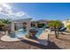 Resort-style pool with a waterfall feature at 18211 W Sequoia Dr, Goodyear, AZ 85338