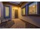 Inviting entryway with a decorative iron door and courtyard at 18211 W Sequoia Dr, Goodyear, AZ 85338