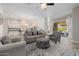 Open living room and kitchen with a view of the pool area at 18211 W Sequoia Dr, Goodyear, AZ 85338