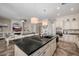 Open kitchen with a large island and stainless steel appliances at 18211 W Sequoia Dr, Goodyear, AZ 85338