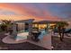 Expansive backyard oasis with a sparkling pool and water feature at 18211 W Sequoia Dr, Goodyear, AZ 85338