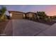Single-story home with a two-car garage and desert landscaping at 18211 W Sequoia Dr, Goodyear, AZ 85338