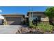 Single-story home with a two-car garage and desert landscaping at 18211 W Sequoia Dr, Goodyear, AZ 85338