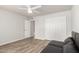 Bedroom with tile floors, double-door closet, and ceiling fan at 9502 W Mcrae Way, Peoria, AZ 85382